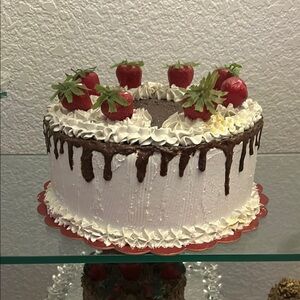 Delicious White and Chocolate Drip Cake with Strawberries